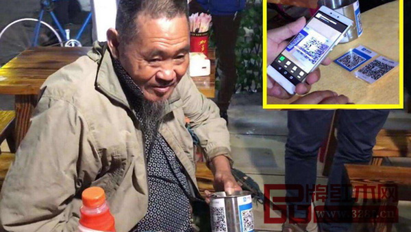一名接受手機支付善款的乞討者 一名接受手機支付善款的乞討者